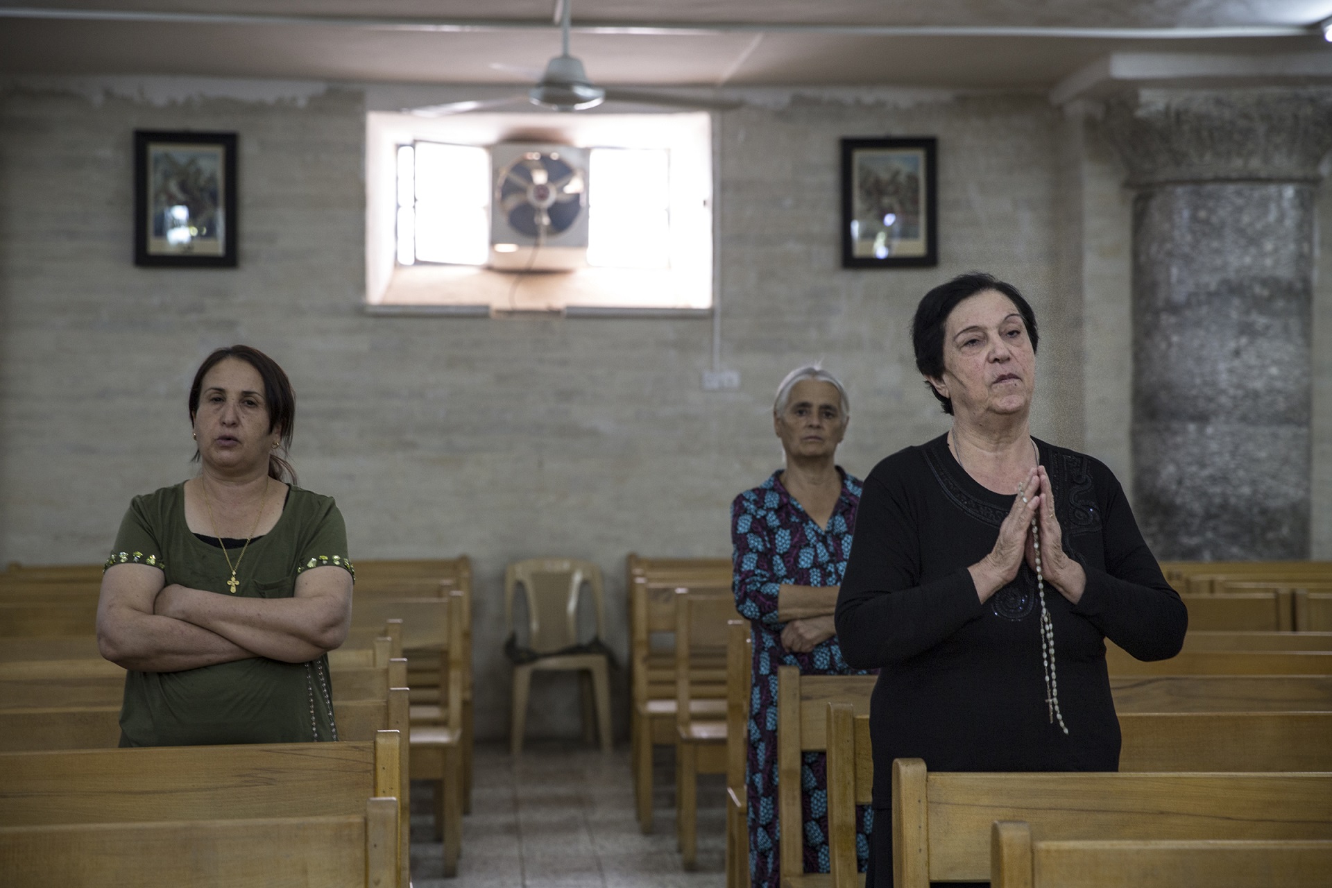 (RNS2-oct27) Afternoon prayer at the St. George Church in the historic Assyrian Christian town of Alqosh in the Nineveh Plain of Iraqi Kurdistan. Locals adhere to the Chaldeon Catholic religion. The town was nearly overrun by Islamic fighters earlier this summer, when Peshmerga forces withdrew their forces, abandoning the Christian town. Photo by Jodi Hilton