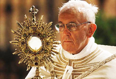 Pope Francis carries a monstrance holding the Blessed Sacrament during the Corpus Christi observance May 30 in Rome. (CNS photo/Paul Haring)  (May 30, 2013) See POPE-CORPUSCHRISTI May 30, 2013.